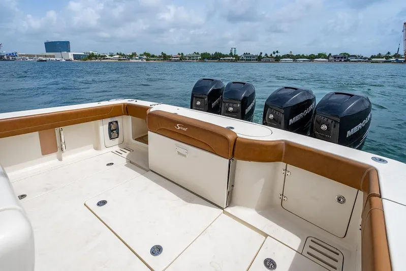  Yacht Photos Pics 2018 Scout 420 LXF boat with four Mercury engines on a calm sea.