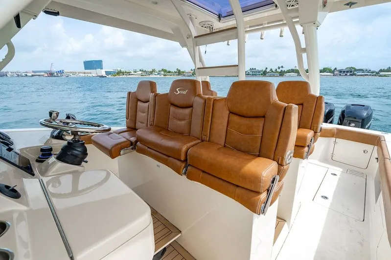  Yacht Photos Pics 2018 Scout 420 LXF boat interior with luxurious brown leather seating.