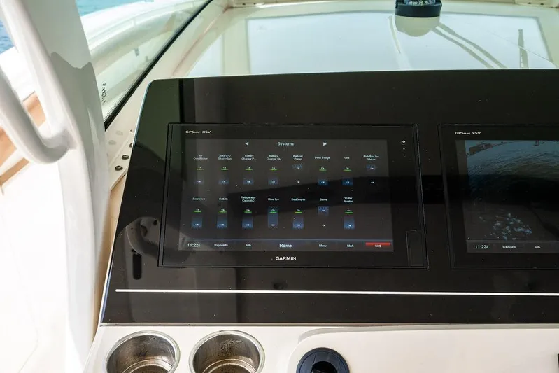  Yacht Photos Pics Control panel of a 2018 Scout 420 LXF boat with Garmin display.