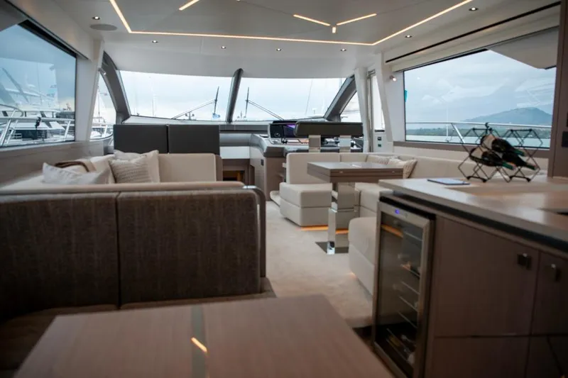  Yacht Photos Pics Luxurious interior of 2025 Sunseeker Manhattan 68 yacht with modern furnishings and panoramic windows.