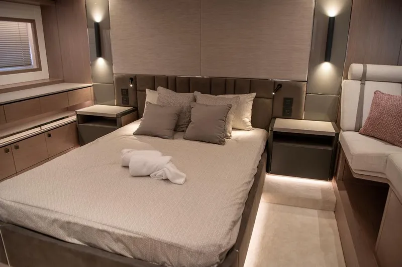  Yacht Photos Pics Luxurious bedroom interior of 2025 Sunseeker Manhattan 68 yacht, featuring elegant design and lighting.