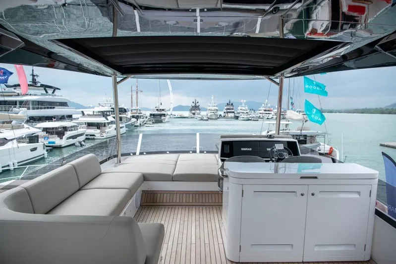  Yacht Photos Pics Luxurious Sunseeker Manhattan 68 yacht interior, 2025 model, with elegant seating and modern amenities.