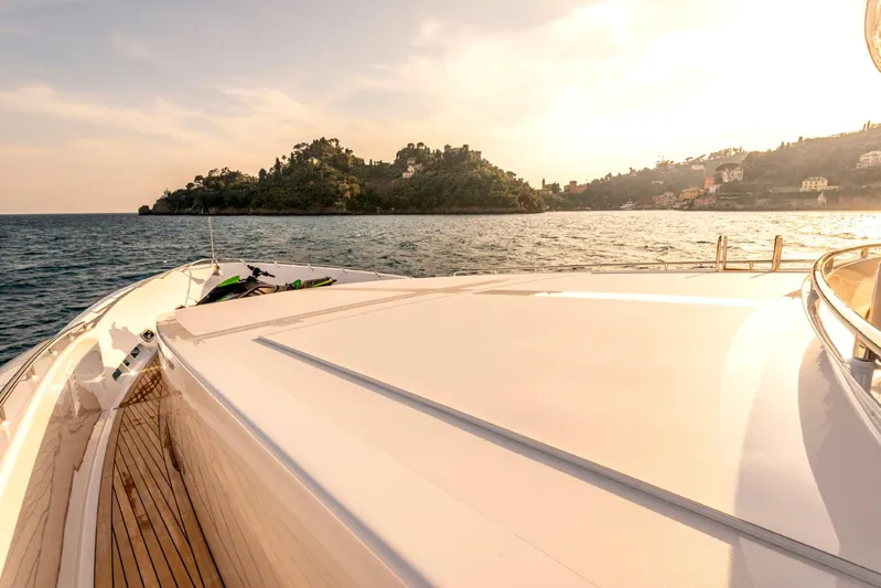  Yacht Photos Pics Luxurious Heesen 38m yacht cruising near scenic coastline at sunset, 2001 model.