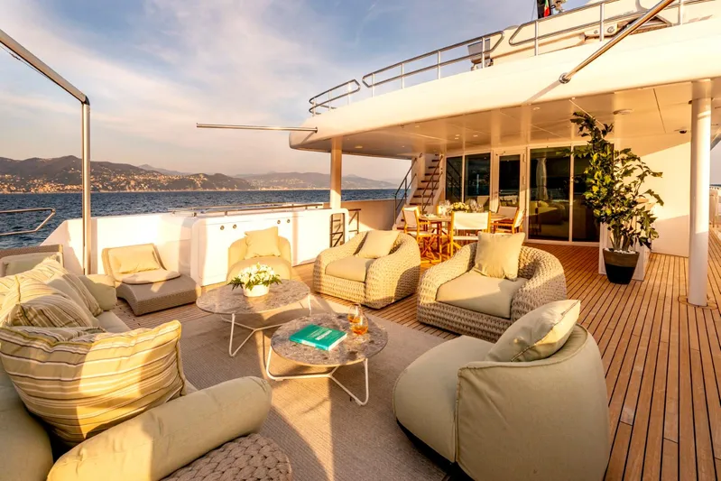  Yacht Photos Pics Luxurious deck of 2001 Heesen 38m yacht with elegant seating and ocean view.