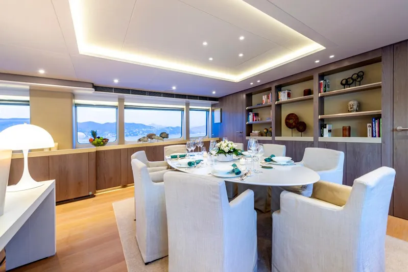  Yacht Photos Pics Luxurious dining area on a 2001 Heesen 38m yacht with elegant decor and scenic views.