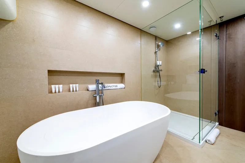  Yacht Photos Pics Luxurious bathroom with freestanding tub and glass shower on Heesen 38m yacht, 2001 model.