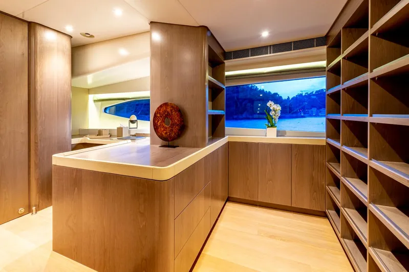  Yacht Photos Pics Luxurious interior of 2001 Heesen 38m yacht with elegant wood finishes and large window view.