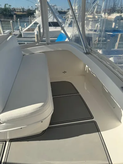 Martin Yacht Photos Pics 2002 Luhrs 36 Convertible boat interior with white seating and marina view.