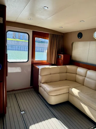 Martin Yacht Photos Pics Interior of 2002 Luhrs 36 Convertible yacht with beige leather seating and wood accents.
