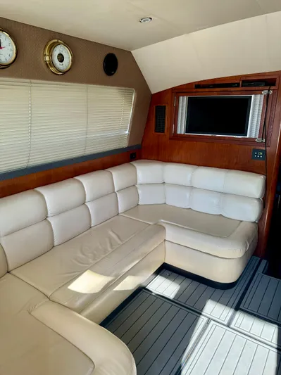 Martin Yacht Photos Pics Luxurious interior of 2002 Luhrs 36 Convertible yacht with cream leather seating.