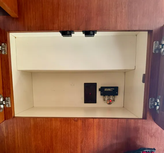 Martin Yacht Photos Pics Empty wooden cabinet with electronic switch, Luhrs 36 Convertible 2002 model.