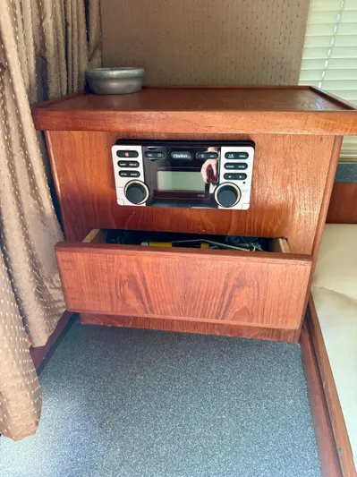 Martin Yacht Photos Pics Wooden cabinet with stereo system in 2002 Luhrs 36 Convertible boat interior.