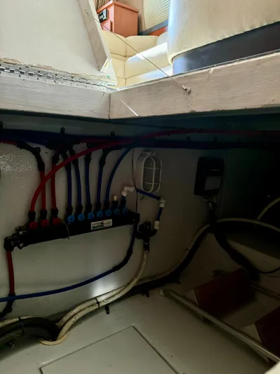 Martin Yacht Photos Pics Engine room of 2002 Luhrs 36 Convertible boat with visible wiring and plumbing.