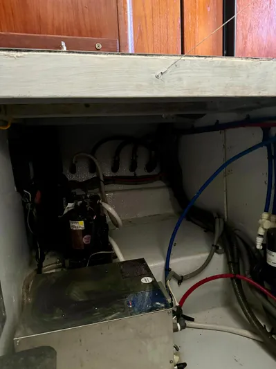 Martin Yacht Photos Pics Engine room of 2002 Luhrs 36 Convertible boat with visible wiring and equipment.