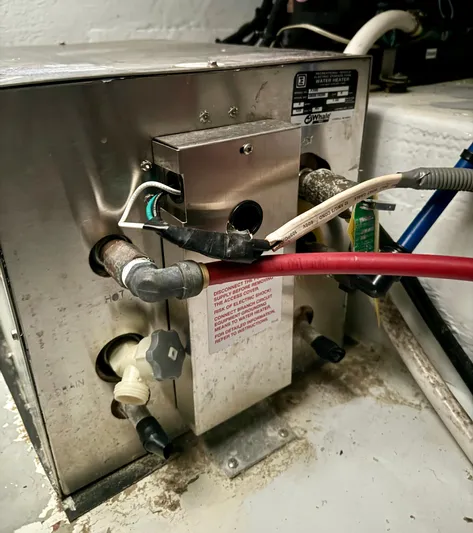 Martin Yacht Photos Pics 2002 Luhrs 36 Convertible boat water heater with connected pipes and wiring.