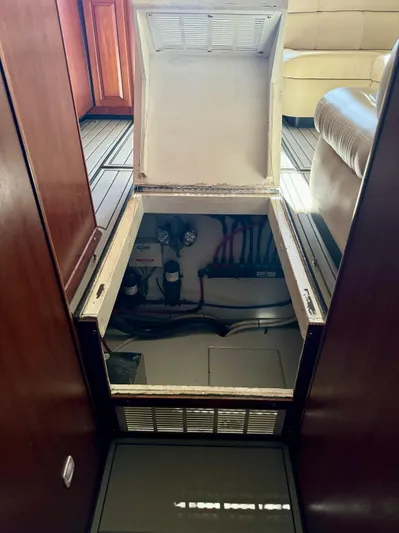 Martin Yacht Photos Pics Open hatch in 2002 Luhrs 36 Convertible boat interior, revealing mechanical components.