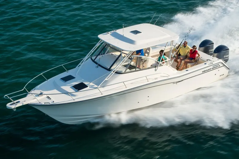  Yacht Photos Pics 2018 Grady-White Express 330 cruising on the ocean with passengers.