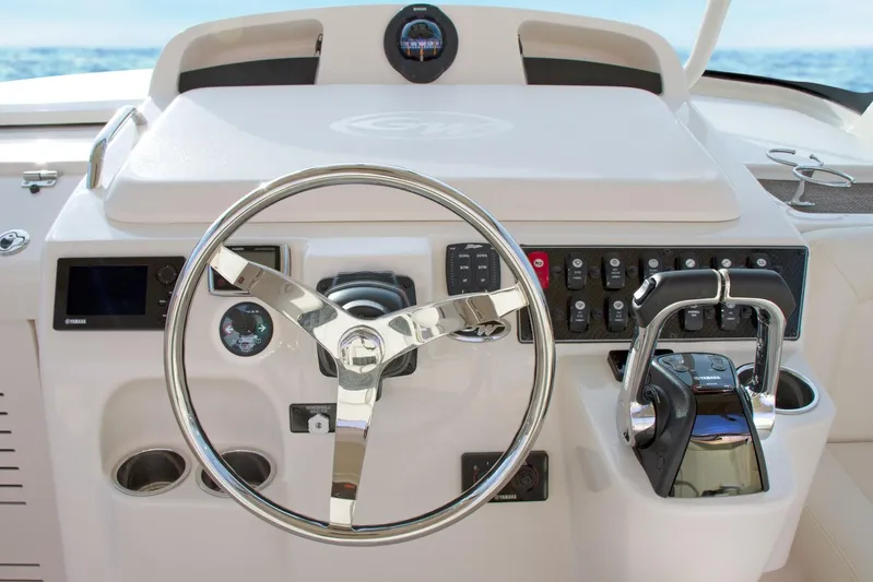  Yacht Photos Pics 2018 Grady-White Express 330 helm with steering wheel and control panel.