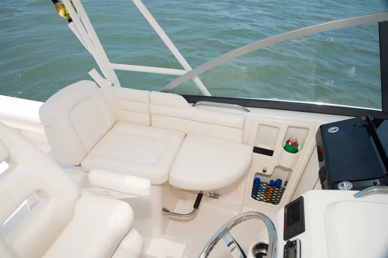  Yacht Photos Pics 2018 Grady-White Express 330 boat interior with white seating and steering wheel.