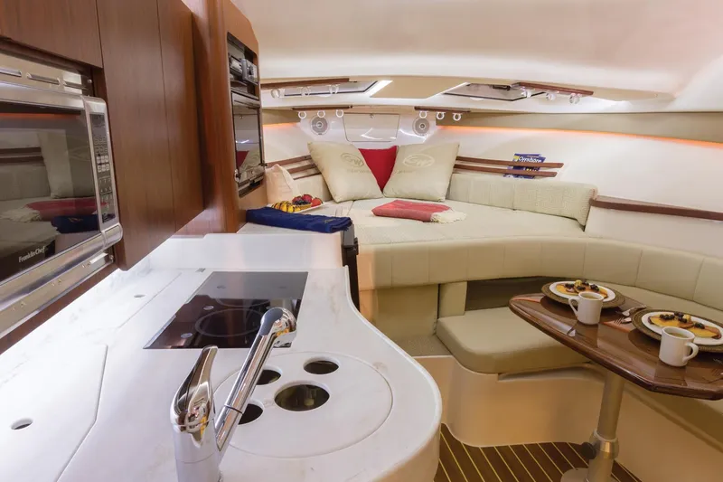  Yacht Photos Pics Interior of 2018 Grady-White Express 330 boat with kitchen and cozy seating area.