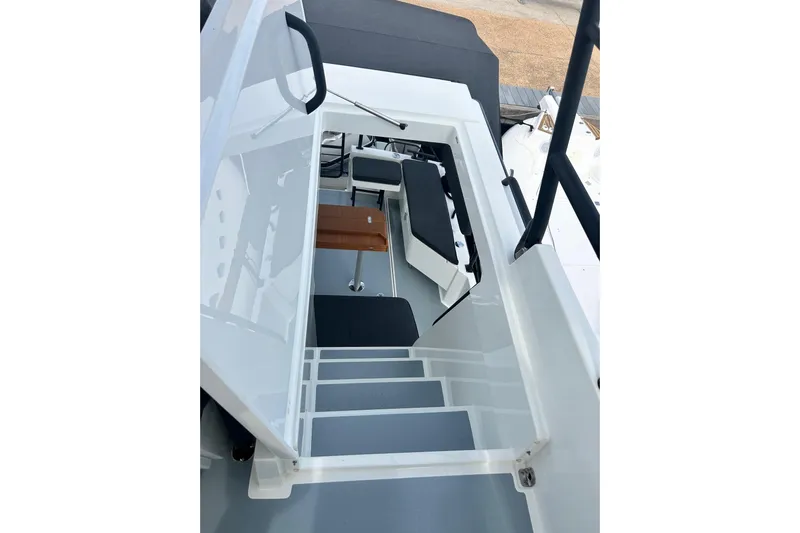  Yacht Photos Pics Interior view of 2022 Botnia Targa 37 boat, showcasing stairs and seating area.