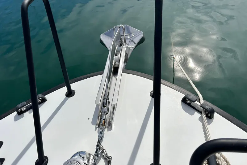  Yacht Photos Pics Bow of 2022 Botnia Targa 37 with anchor and calm water reflection.