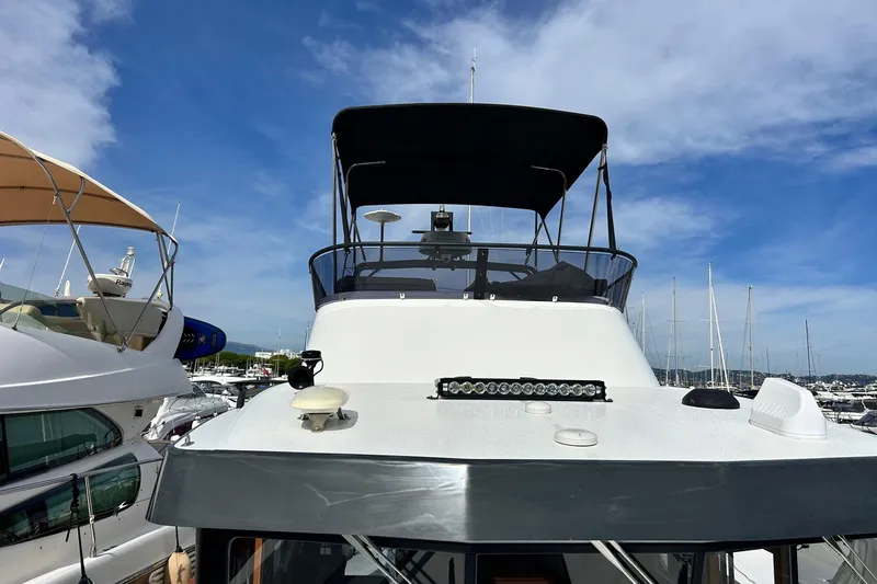  Yacht Photos Pics 2022 Botnia Targa 37 yacht with sleek design, docked under clear blue sky.