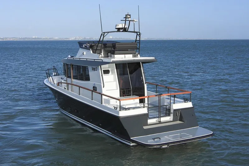  Yacht Photos Pics 2022 Botnia Targa 37 boat cruising on open water under clear skies.