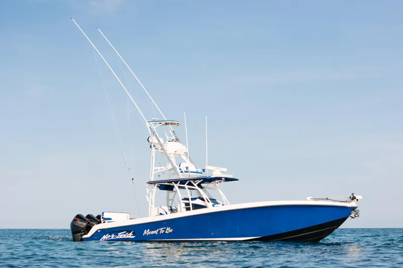  Yacht Photos Pics 2022 Nor-Tech 392 Super Fish boat on open water, blue and white design.