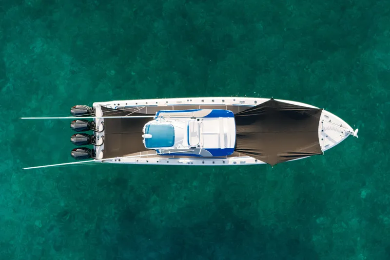  Yacht Photos Pics Aerial view of 2022 Nor-Tech 392 Super Fish boat on clear turquoise water.