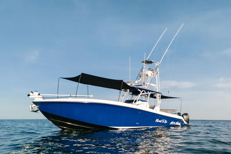  Yacht Photos Pics 2022 Nor-Tech 392 Super Fish boat on calm ocean waters under clear sky.
