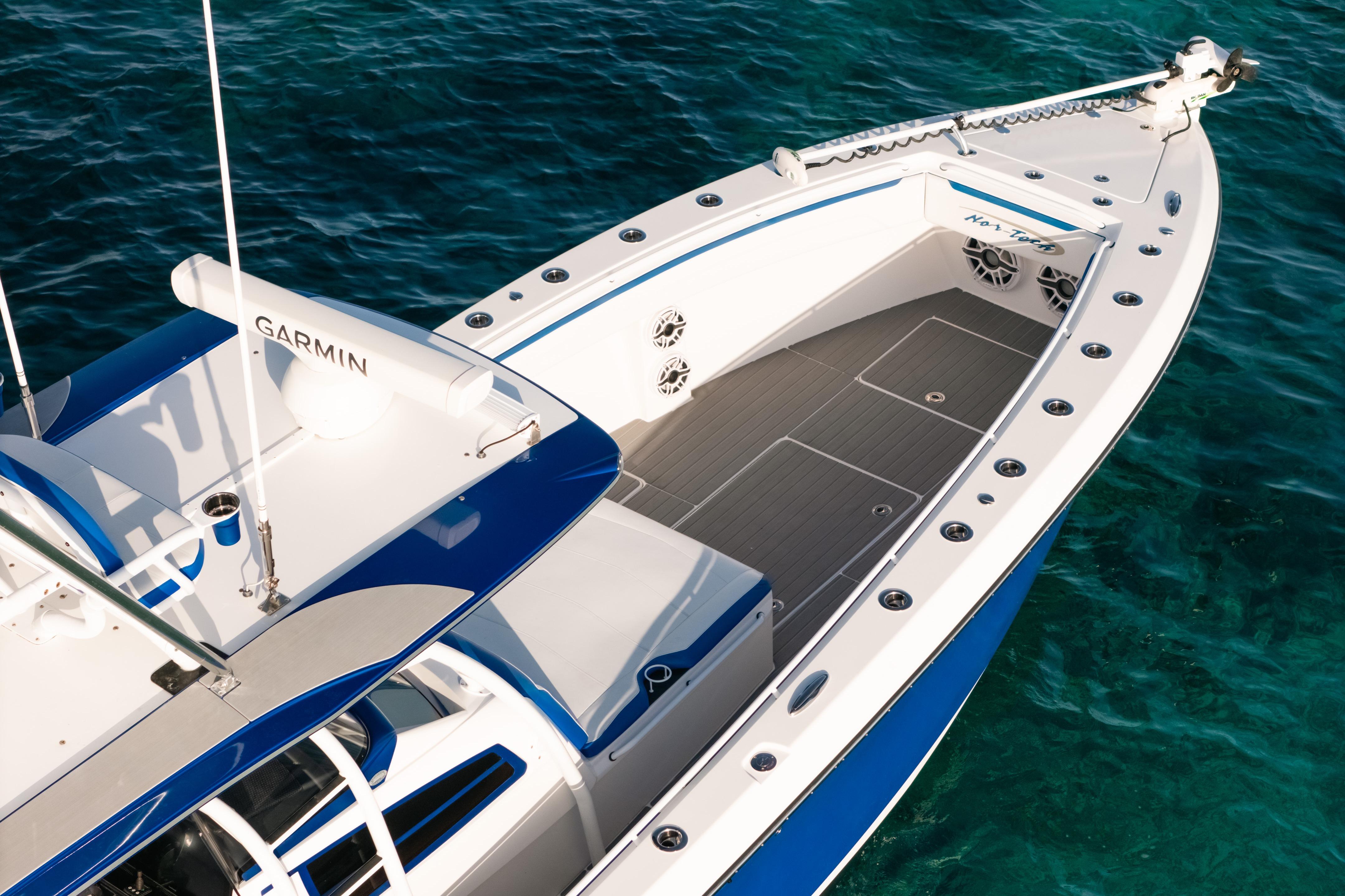 2022 Nor-Tech 392 Super Fish boat on clear blue water, featuring Garmin equipment.