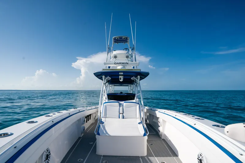  Yacht Photos Pics 2022 Nor-Tech 392 Super Fish boat on open ocean under clear blue sky.