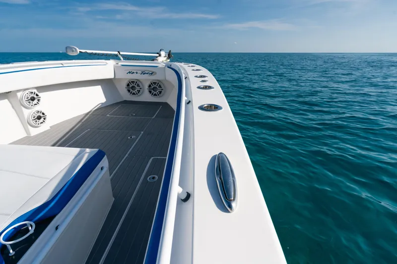  Yacht Photos Pics 2022 Nor-Tech 392 Super Fish boat on open ocean, showcasing sleek design and spacious deck.