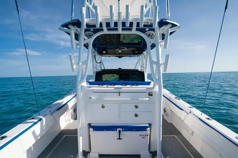  Yacht Photos Pics 2022 Nor-Tech 392 Super Fish boat interior with ocean view, featuring advanced navigation equipment.