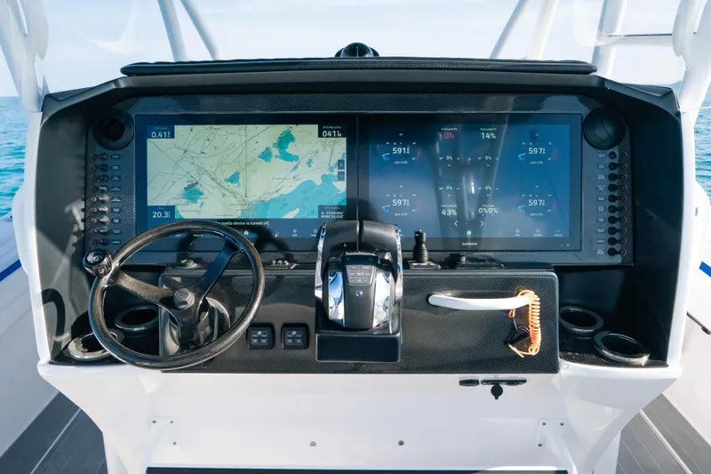  Yacht Photos Pics Helm of 2022 Nor-Tech 392 Super Fish with advanced navigation displays and controls.