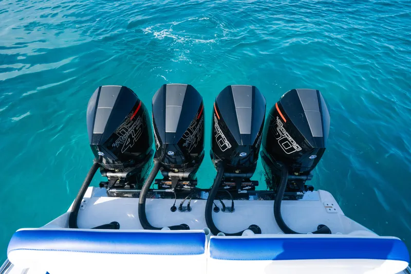  Yacht Photos Pics 2022 Nor-Tech 392 Super Fish boat with four powerful outboard engines on blue water.