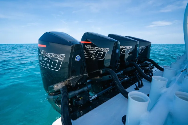  Yacht Photos Pics 2022 Nor-Tech 392 Super Fish with four powerful outboard engines on open water.