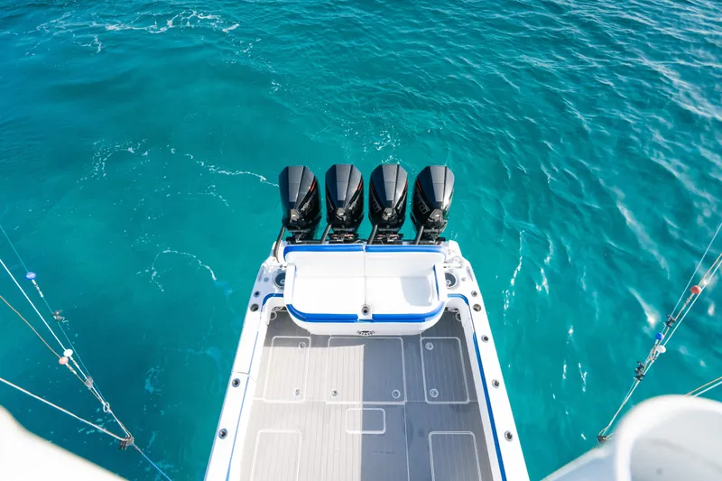  Yacht Photos Pics 2022 Nor-Tech 392 Super Fish boat with four engines on turquoise water.