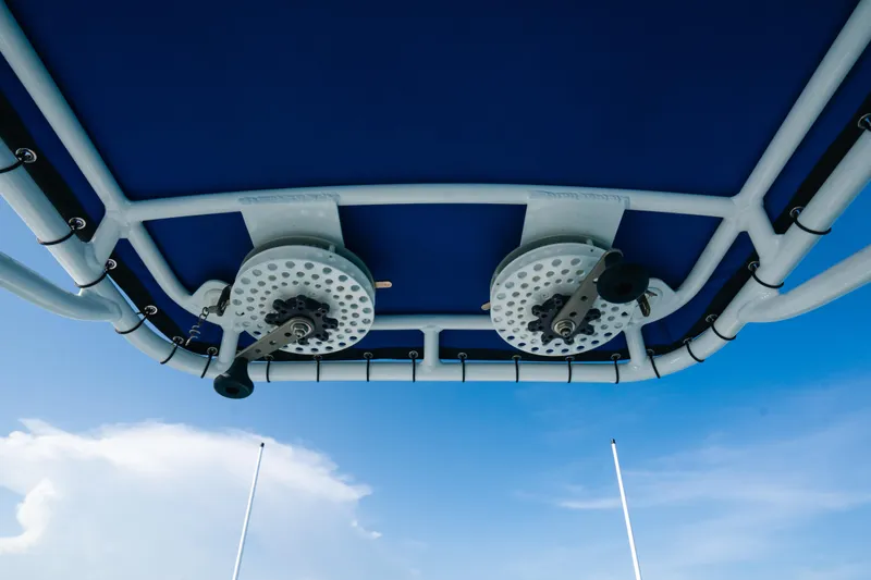  Yacht Photos Pics 2022 Nor-Tech 392 Super Fish boat canopy with fishing rod holders against blue sky.