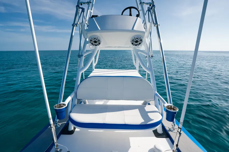  Yacht Photos Pics 2022 Nor-Tech 392 Super Fish boat on open sea, featuring sleek design and comfortable seating.