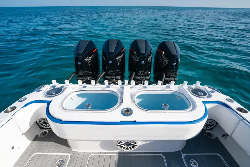  Yacht Photos Pics 2022 Nor-Tech 392 Super Fish boat with four powerful outboard engines on open sea.