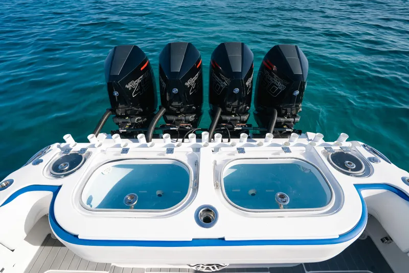  Yacht Photos Pics 2022 Nor-Tech 392 Super Fish boat with four powerful outboard engines on clear blue water.