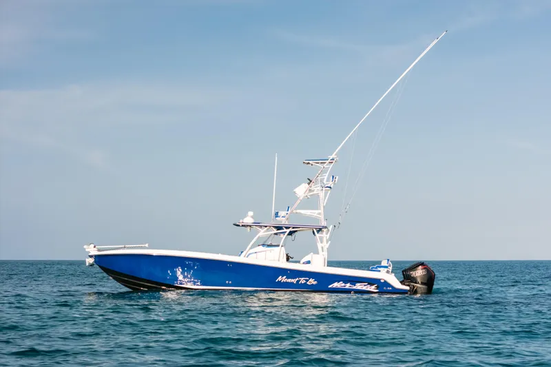  Yacht Photos Pics 2022 Nor-Tech 392 Super Fish boat on calm ocean waters under clear sky.