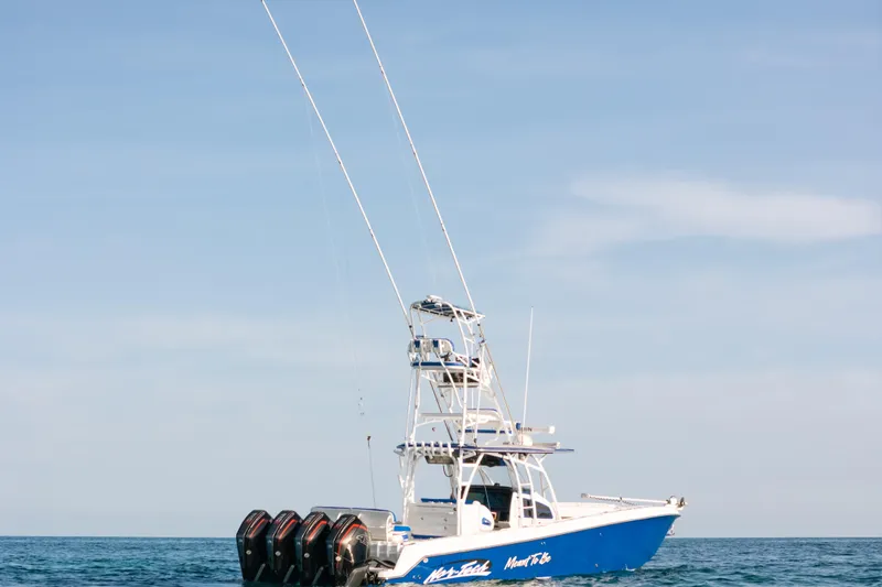  Yacht Photos Pics 2022 Nor-Tech 392 Super Fish boat on open water, featuring multiple outboard engines.