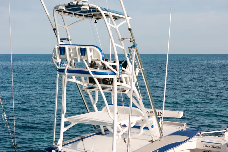  Yacht Photos Pics 2022 Nor-Tech 392 Super Fish boat with tower, on calm ocean waters.