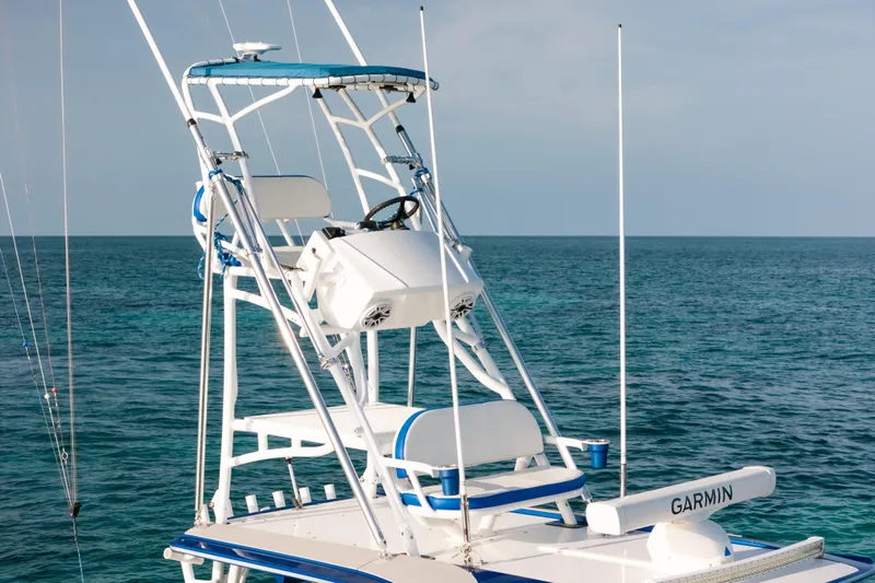  Yacht Photos Pics 2022 Nor-Tech 392 Super Fish boat with elevated helm, ocean backdrop.