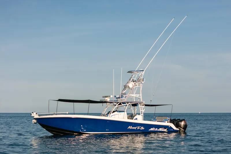  Yacht Photos Pics 2022 Nor-Tech 392 Super Fish boat on calm ocean waters under clear sky.