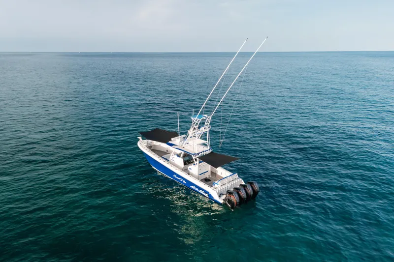  Yacht Photos Pics 2022 Nor-Tech 392 Super Fish boat on open sea, featuring dual antennas.