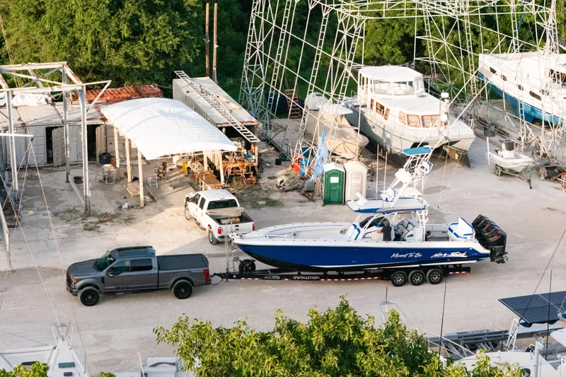  Yacht Photos Pics 2022 Nor-Tech 392 Super Fish boat on trailer at a marina with surrounding boats.